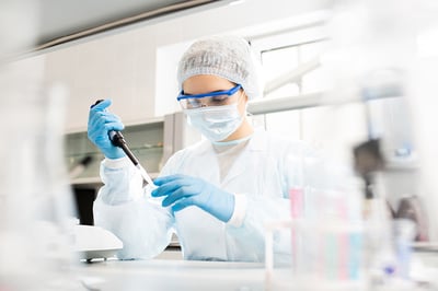 Lab technician using a pipette