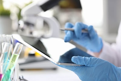 Lab technician using a tablet